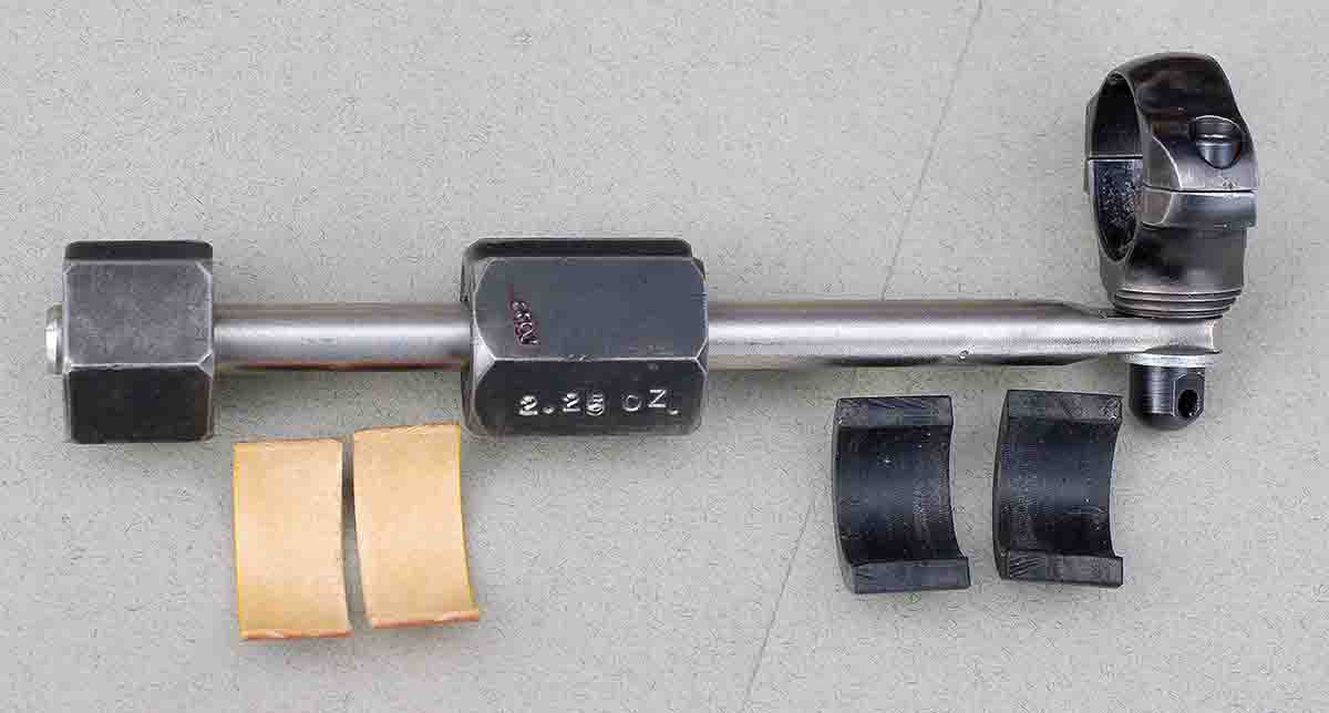 The entire unit and sliding weights can be moved and locked at any position as a means of changing barrel motion.